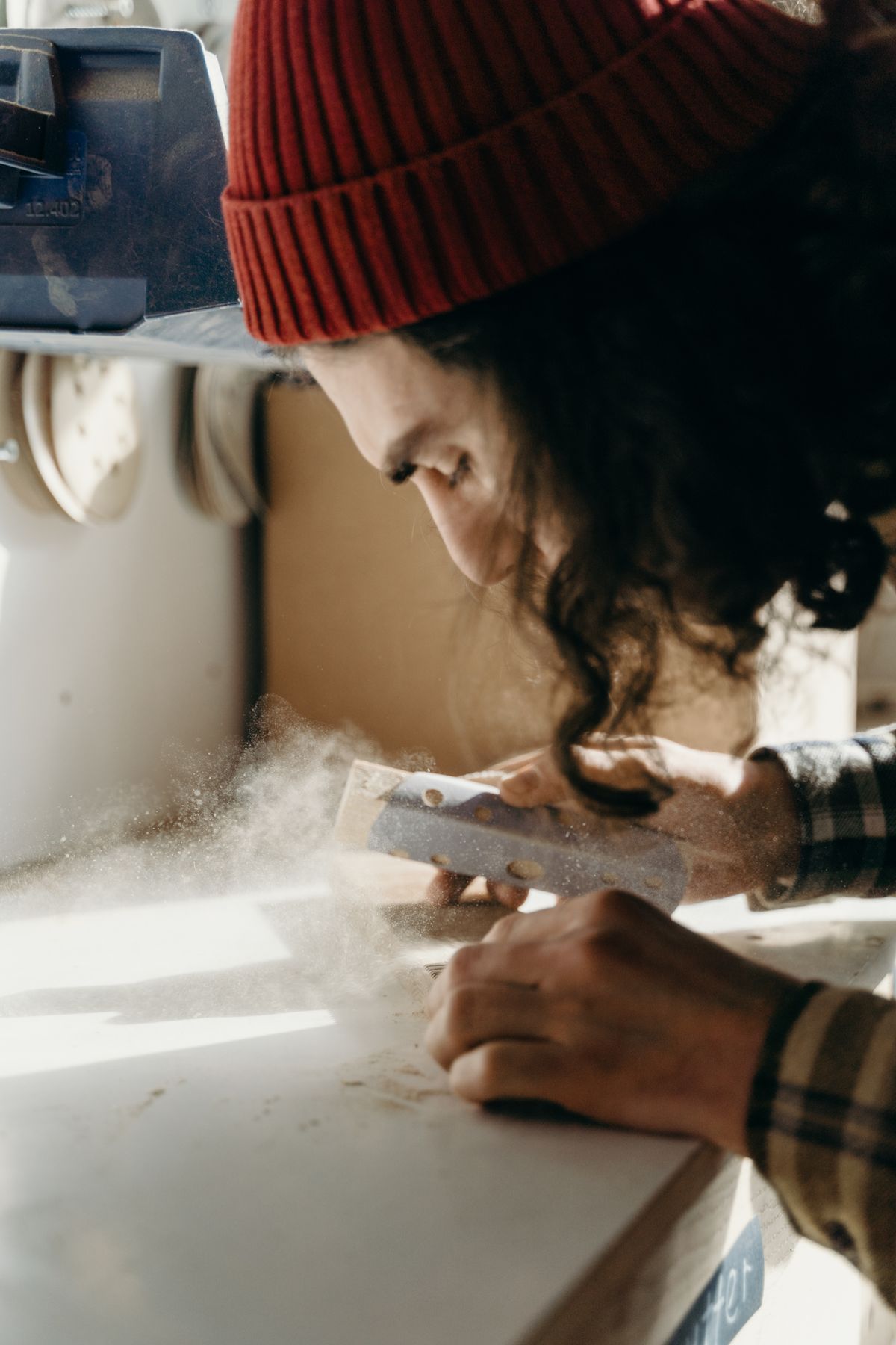 Sanding, polishing, varnishing, and touch-up work for wooden surfaces.